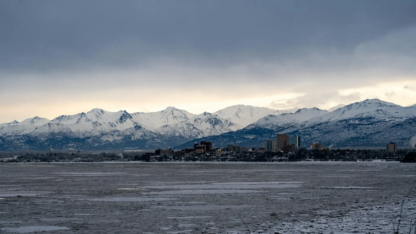 Downtown Anchorage skyline with the Chugach Mountains, Alaska - Tides Health